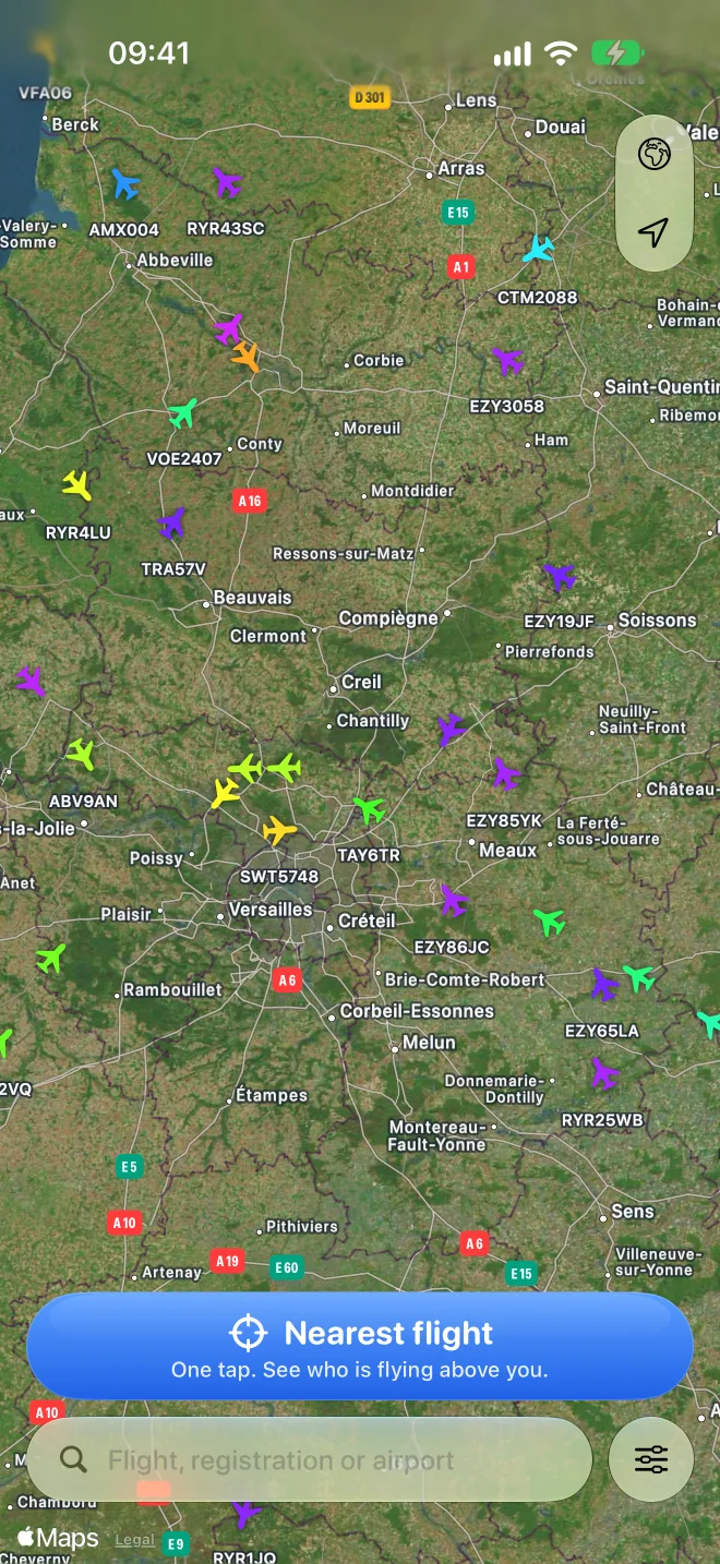 AeroCheck map around Paris full of aircraft colored by altitude, with the Nearest flight button at the bottom.